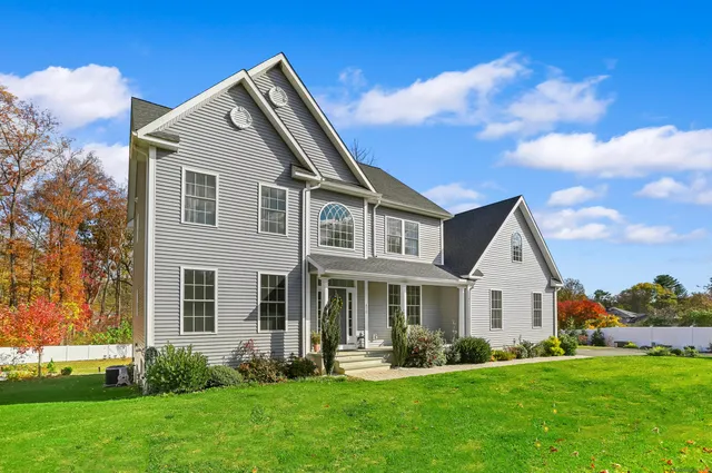 a front view of a house with a yard