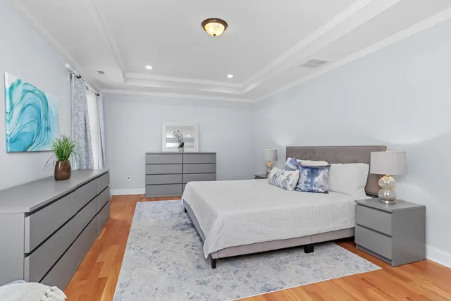 a bedroom with a bed and a couch