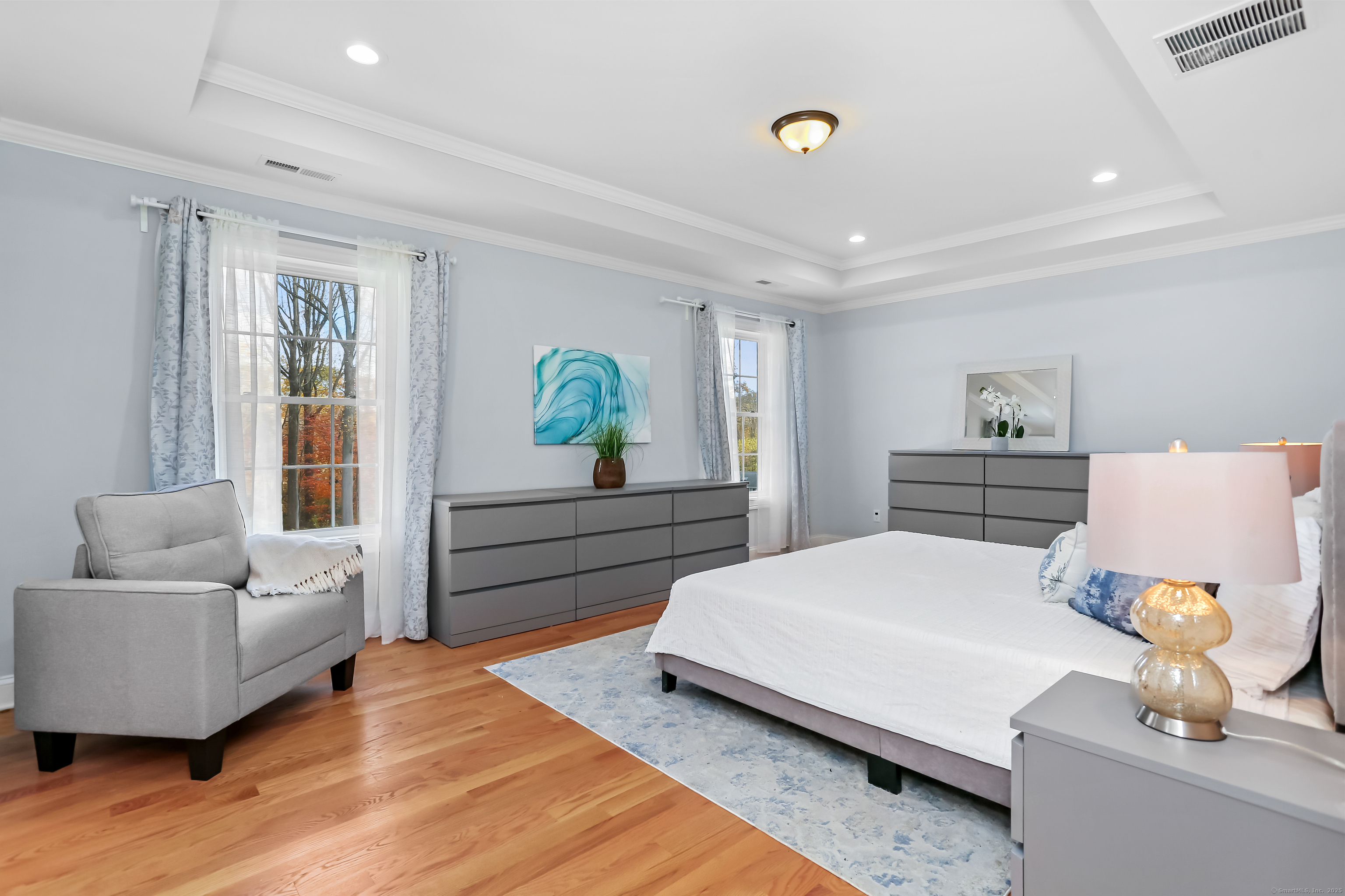 450 James Farm Road Stratford, CT 06614 - Photo 19 of 36 a bedroom with a bed and wooden floor