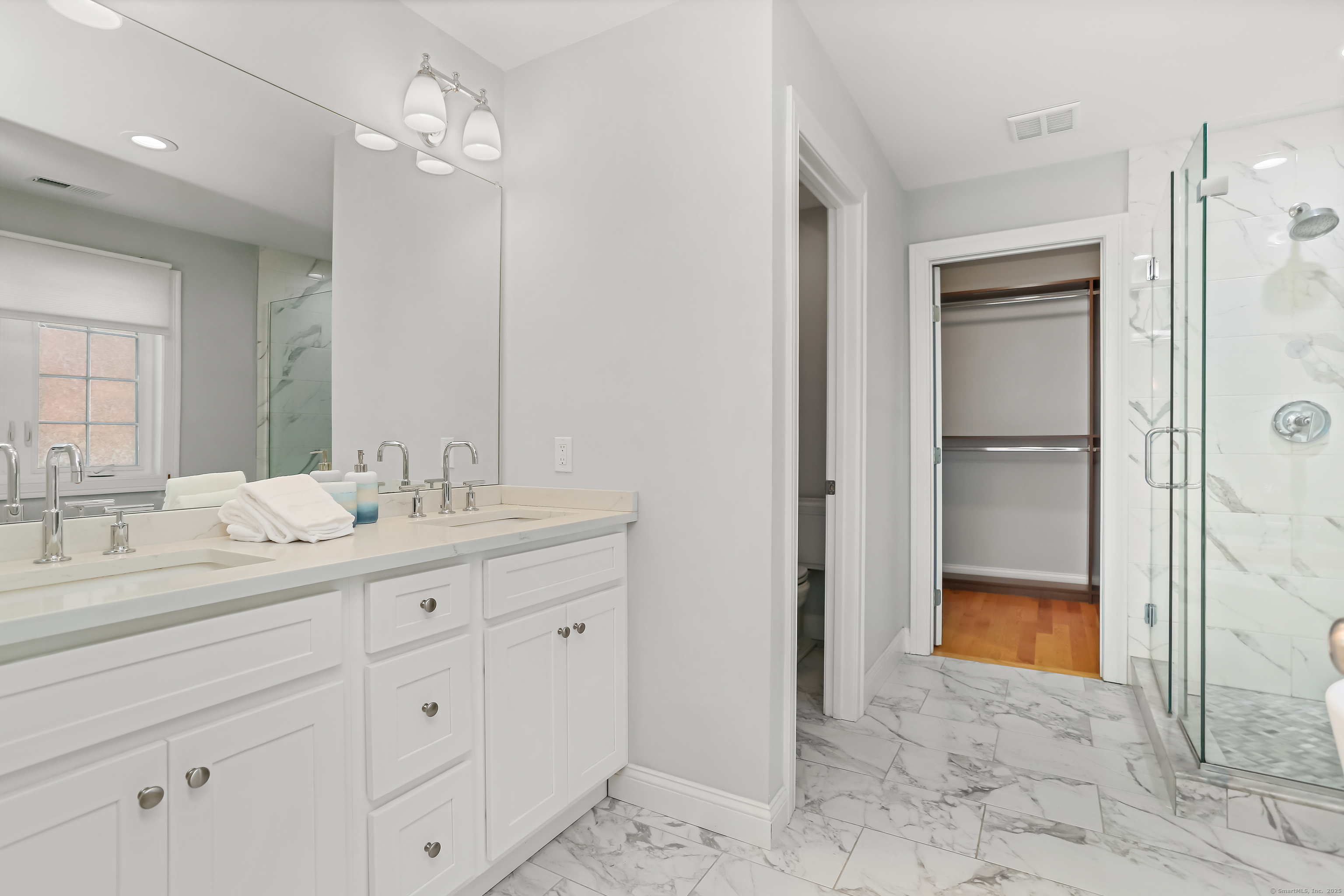 450 James Farm Road Stratford, CT 06614 - Photo 20 of 36 a bathroom with a double vanity sink and a mirror