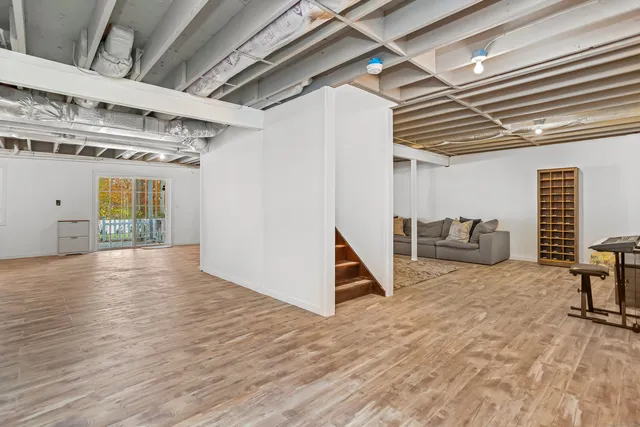 a view of a room with wooden floor