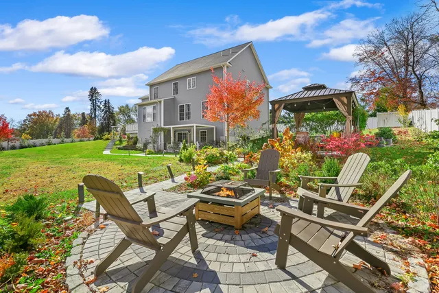 a view of a chairs and table in a yard
