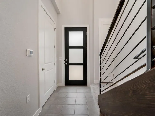 a view of entryway with a door