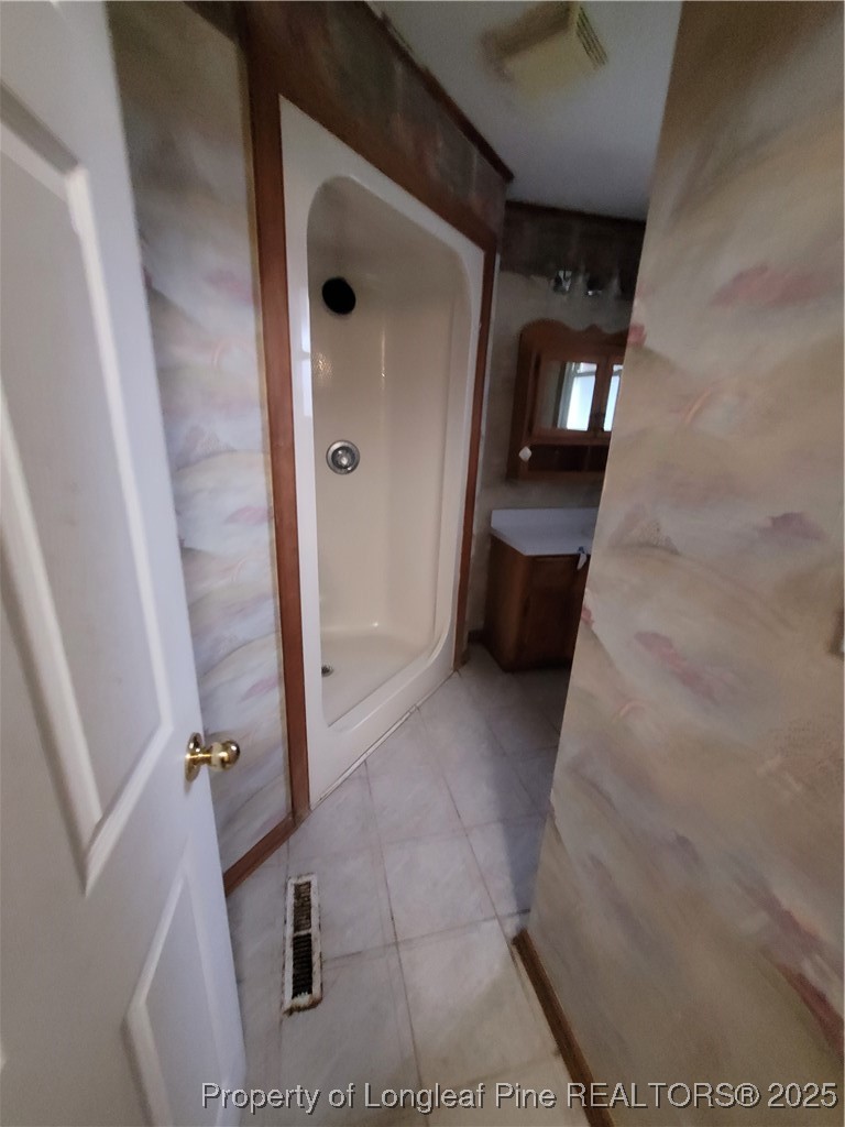 599 Haws Run Road Jacksonville, NC 28540 - Photo 32 of 43 a view of a hallway with wooden floor and staircase