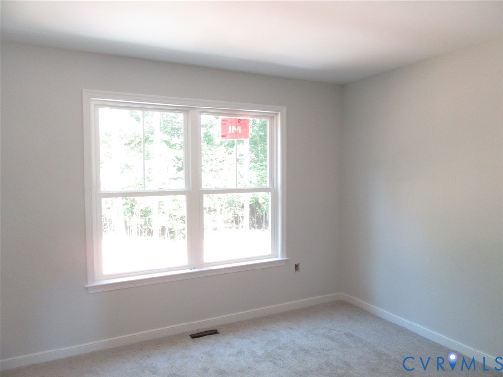 10314 White Oak Church Road Wilsons, VA 23894 - Photo 20 of 21 an empty room with a window