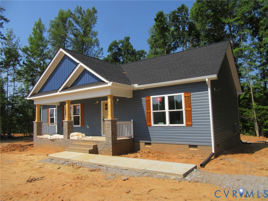 10314 White Oak Church Road Wilsons, VA 23894 - Photo 6 of 21 a front view of a house with a yard outdoor seating and yard in the back