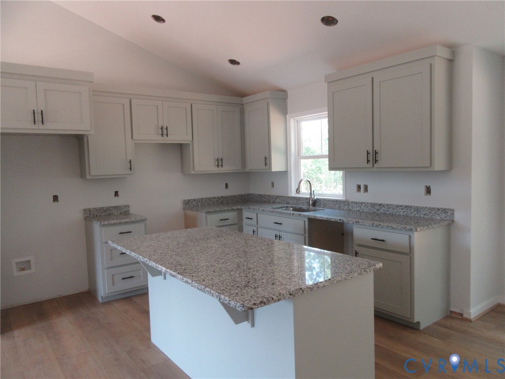 Lot 5 White Oak Church Road Wilsons, VA 23894 - Photo 6 of 17 a kitchen with stainless steel appliances granite countertop a sink stove and cabinets