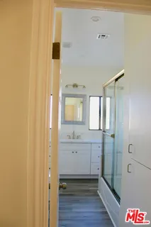 a spacious bathroom with a shower and a sink