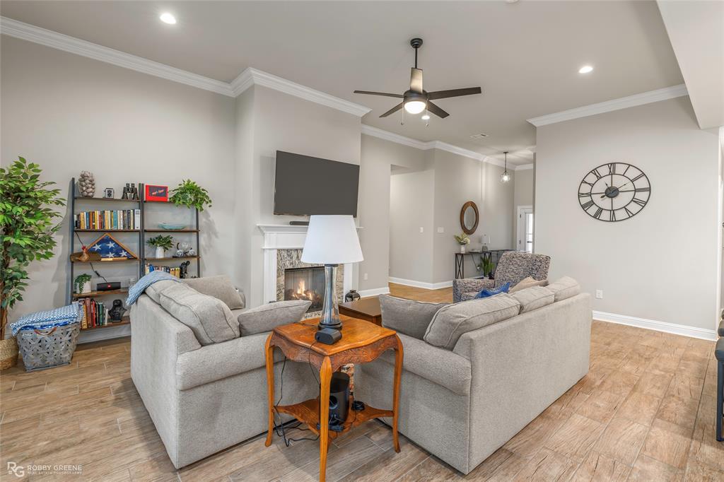 122 Brimestone Loop Benton, LA 71006 - Photo 12 of 33 a living room with fireplace furniture and a flat screen tv