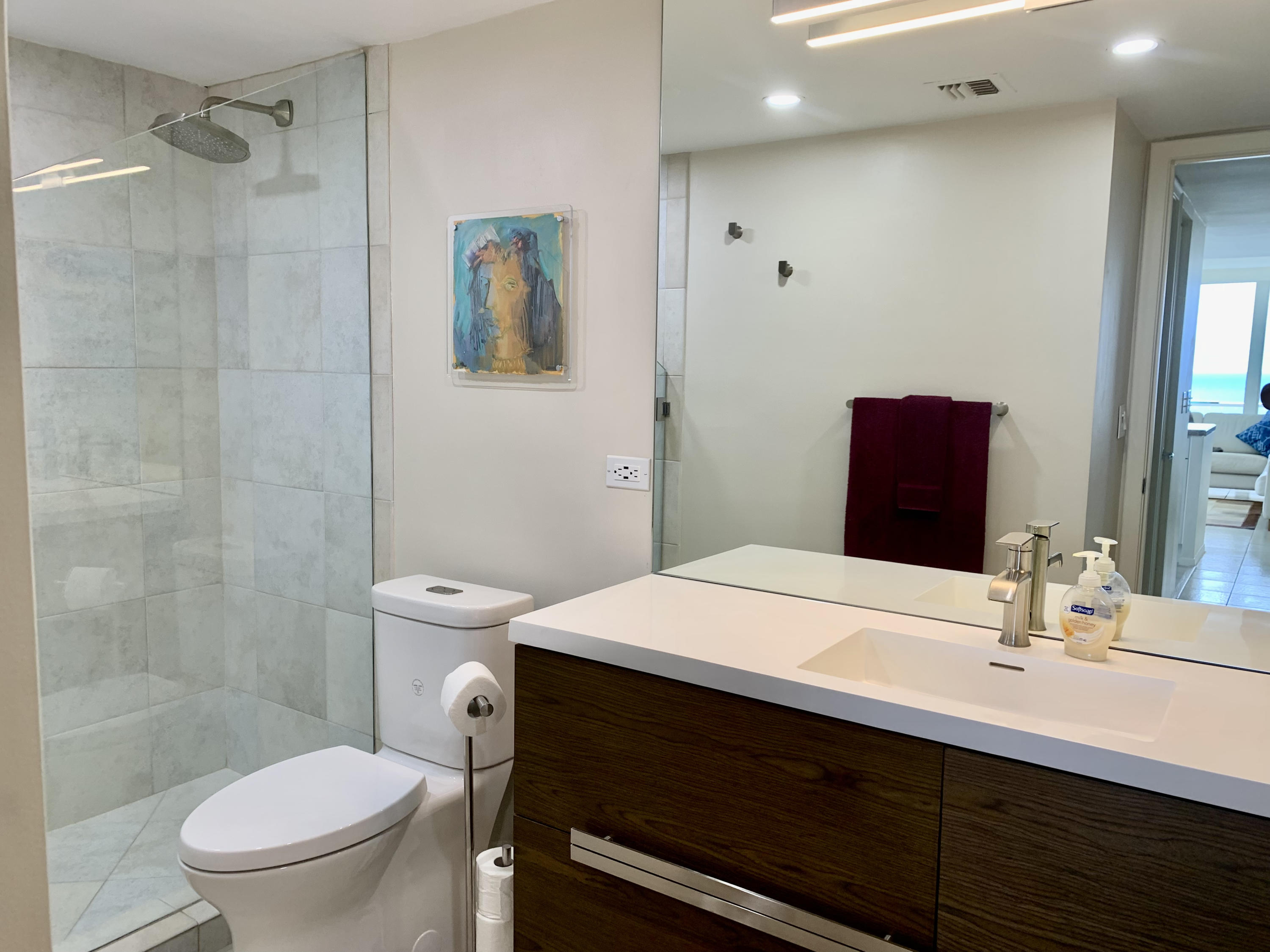 5540 North Ocean Drive, Unit PHA Riviera Beach, FL 33404 - Photo 17 of 42 a bathroom with a sink a toilet and shower