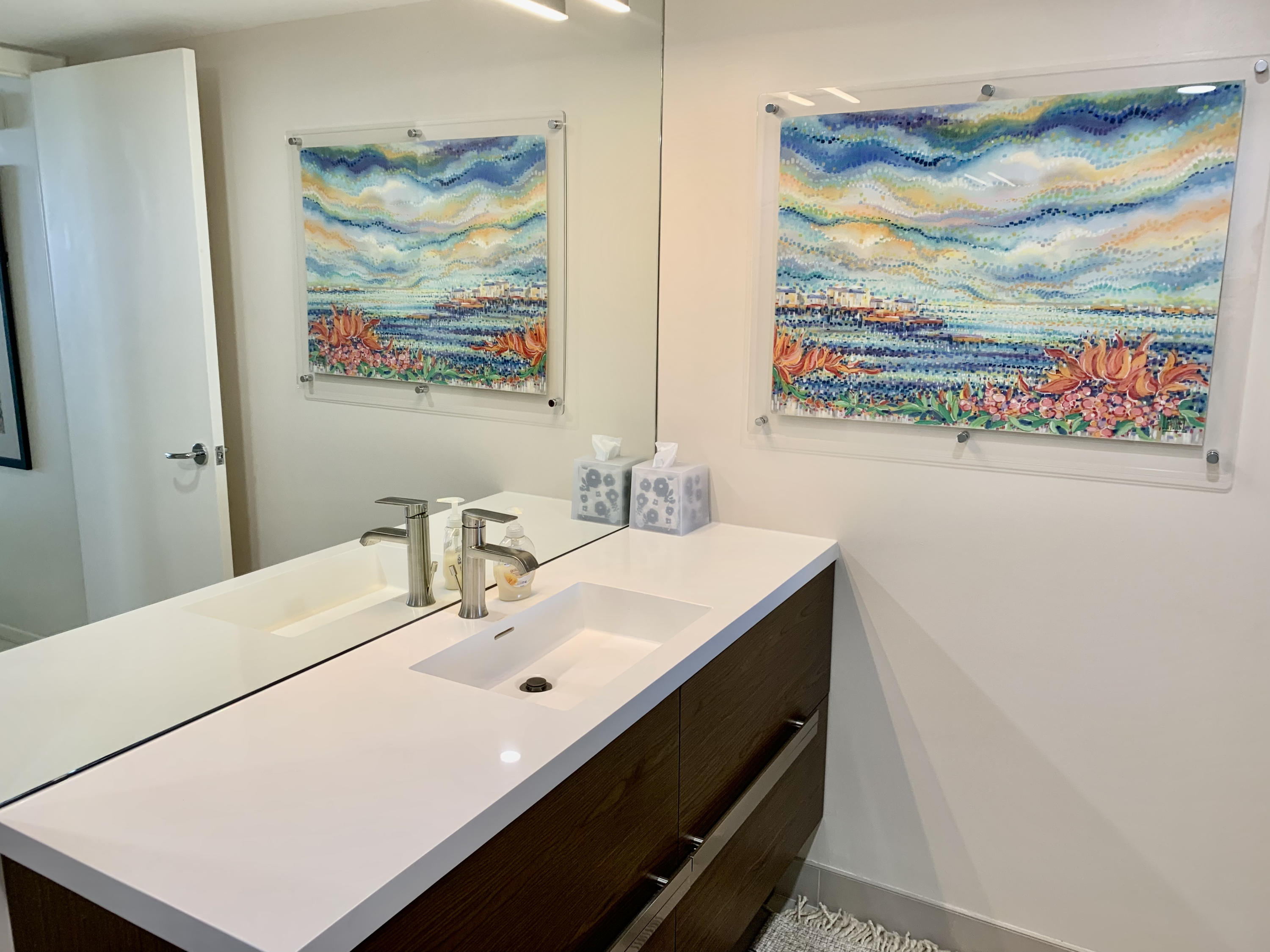 5540 North Ocean Drive, Unit PHA Riviera Beach, FL 33404 - Photo 19 of 42 a bathroom with a sink mirror and vanity