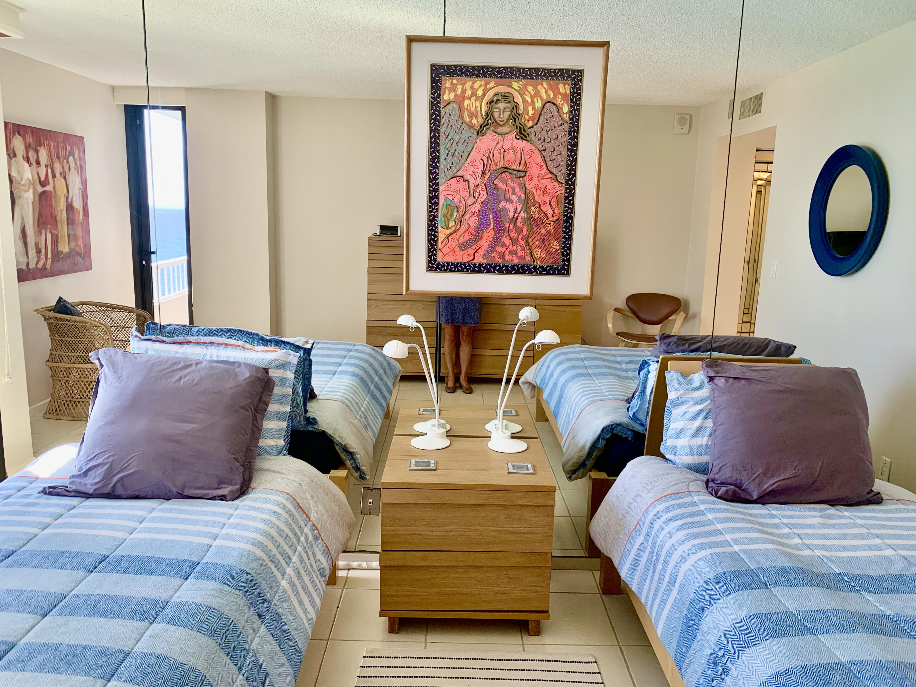 5540 North Ocean Drive, Unit PHA Riviera Beach, FL 33404 - Photo 21 of 42 a bedroom with two beds and painting on the wall