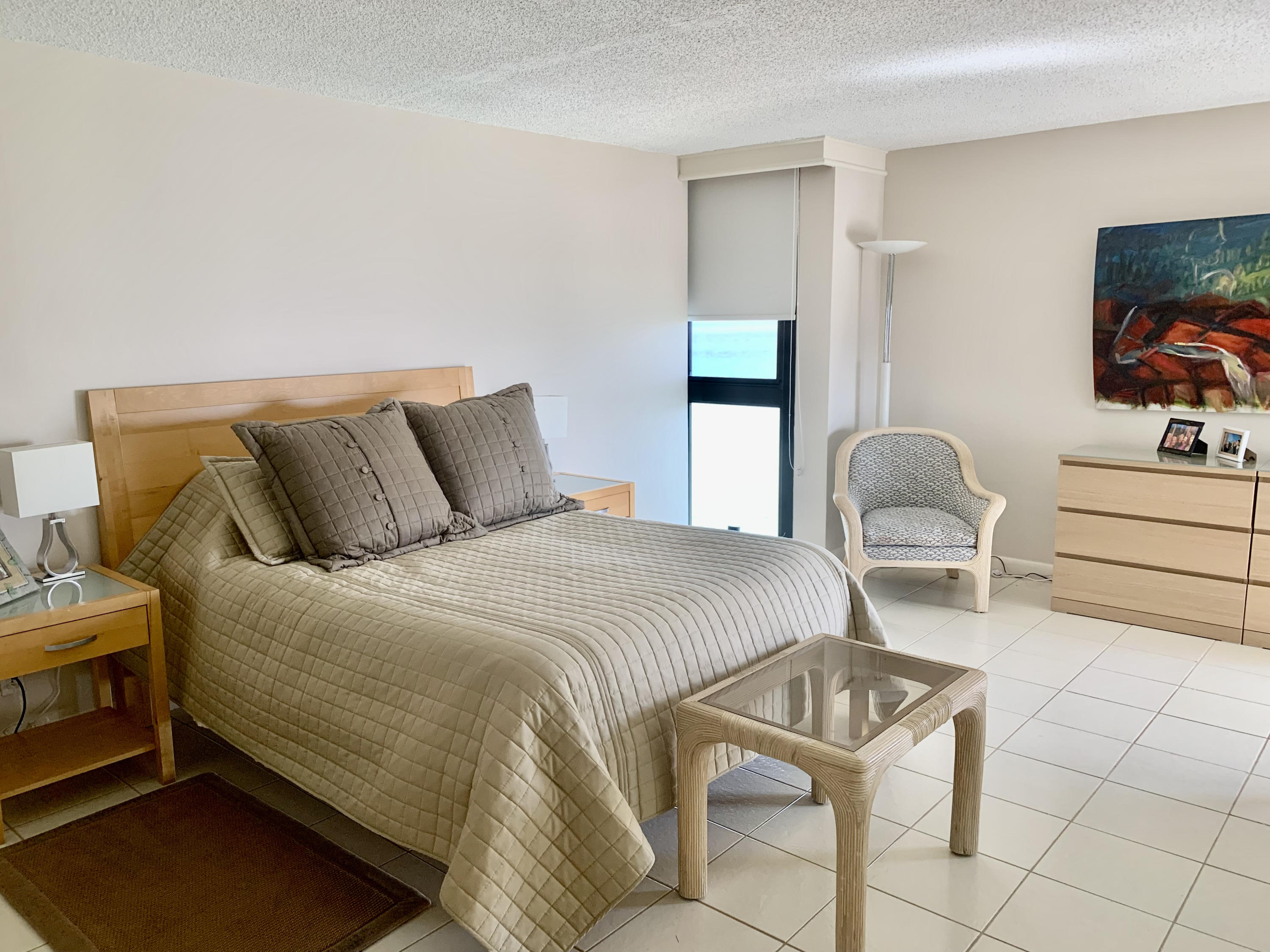 5540 North Ocean Drive, Unit PHA Riviera Beach, FL 33404 - Photo 24 of 42 a bedroom with a bed and a flat screen tv