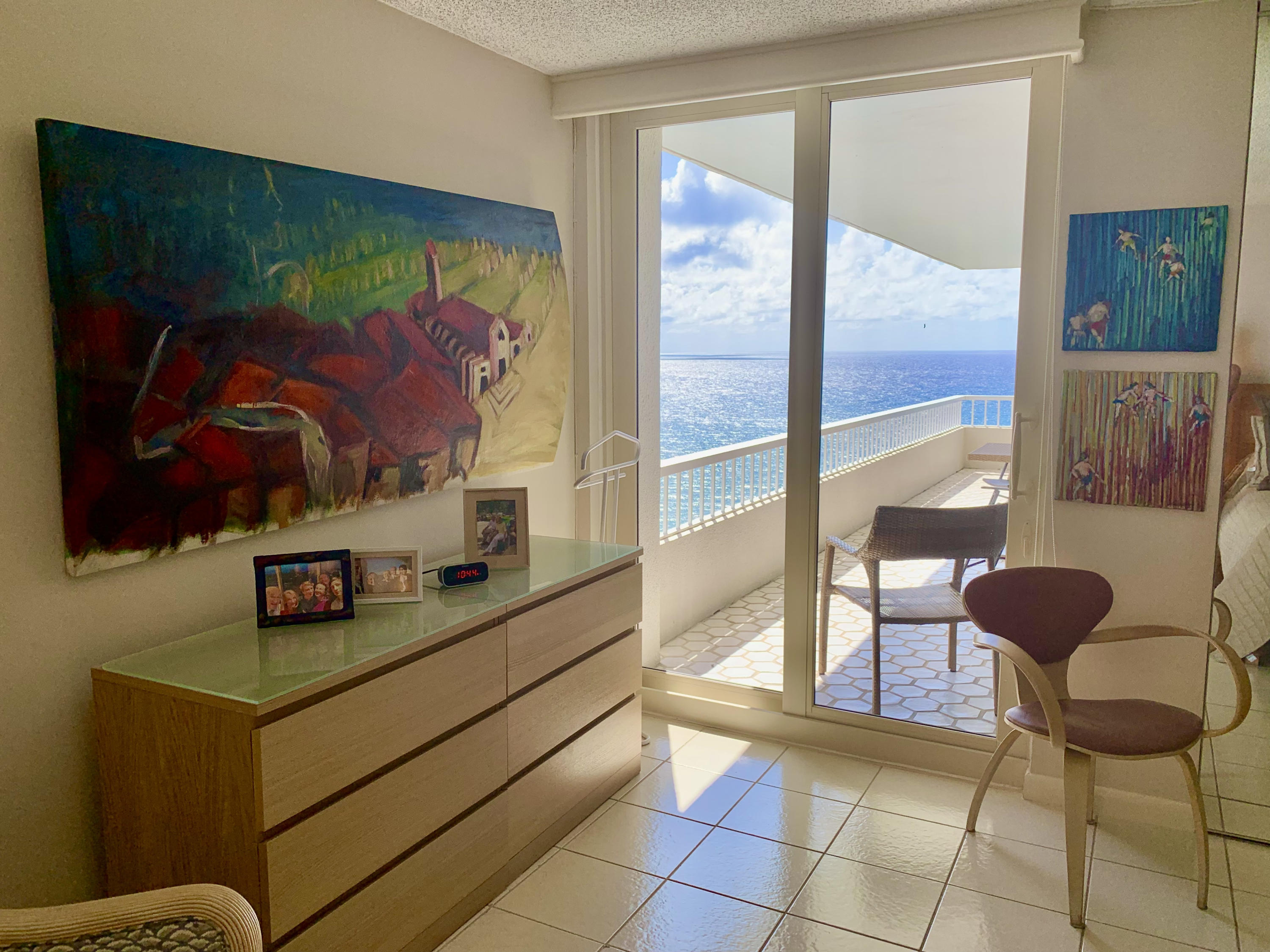 5540 North Ocean Drive, Unit PHA Riviera Beach, FL 33404 - Photo 25 of 42 a room with furniture and a floor to ceiling window