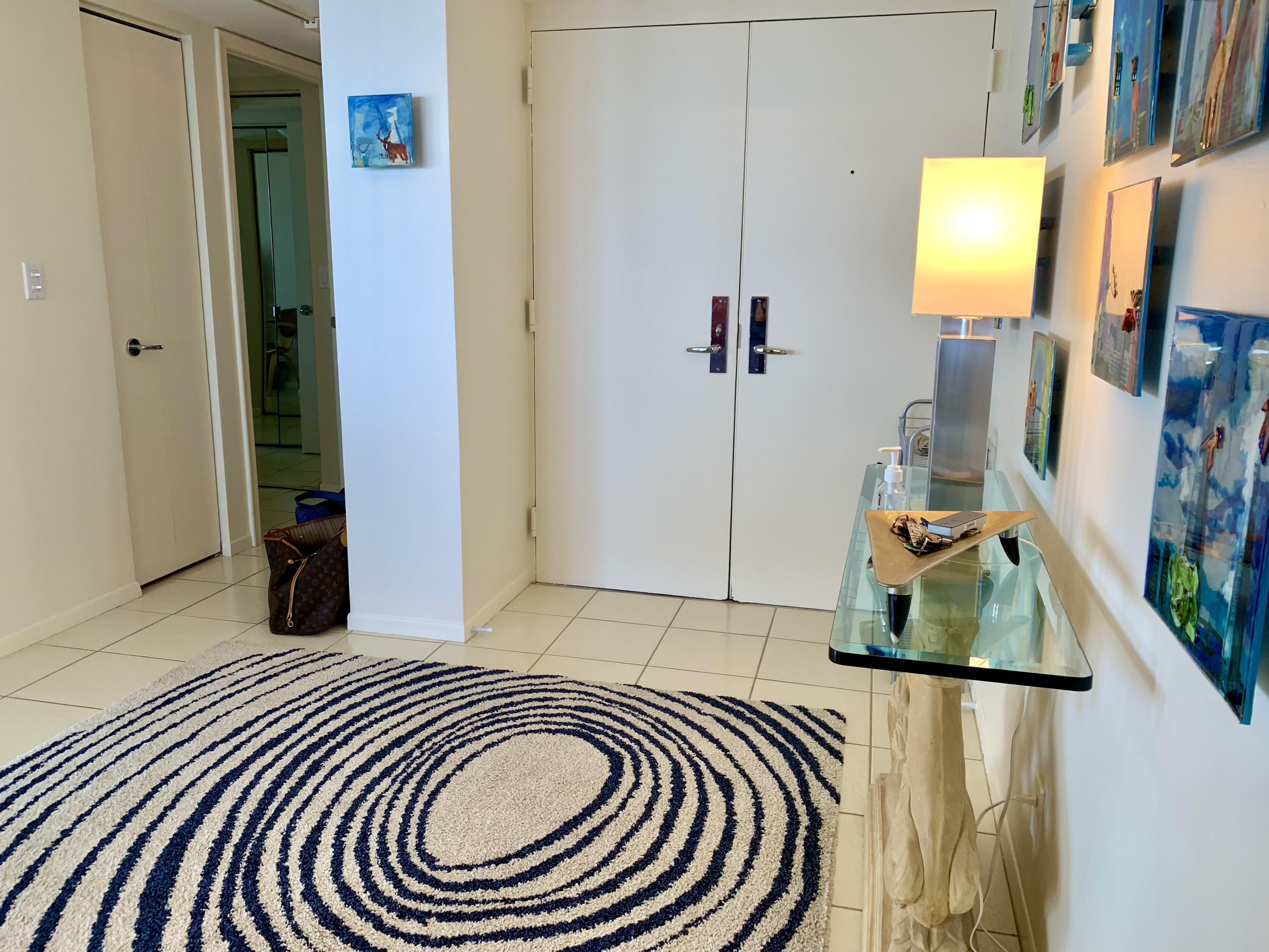 5540 North Ocean Drive, Unit PHA Riviera Beach, FL 33404 - Photo 31 of 42 a bedroom with a bed and a mirror