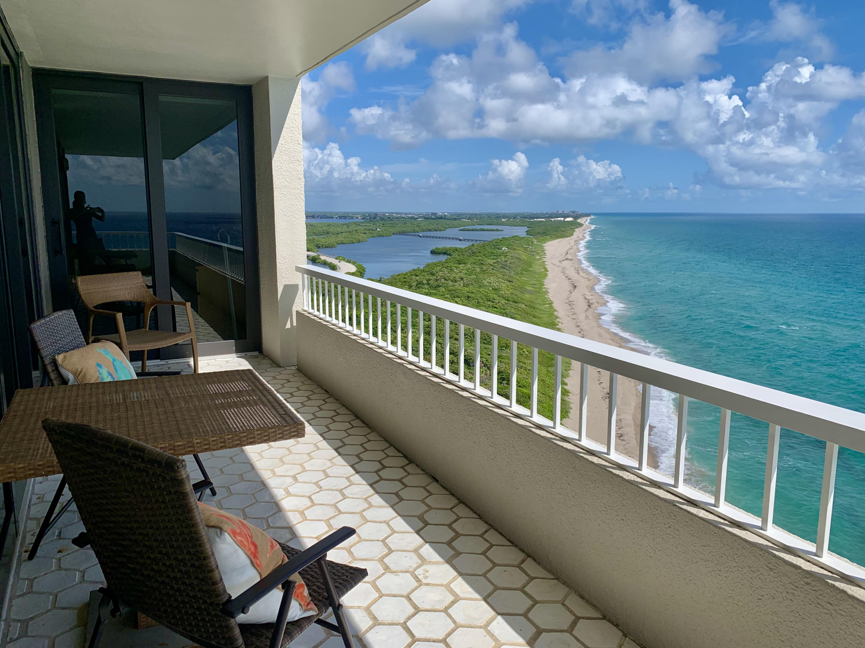 5540 North Ocean Drive, Unit PHA Riviera Beach, FL 33404 - Photo 32 of 42 a view of a balcony with chair and table