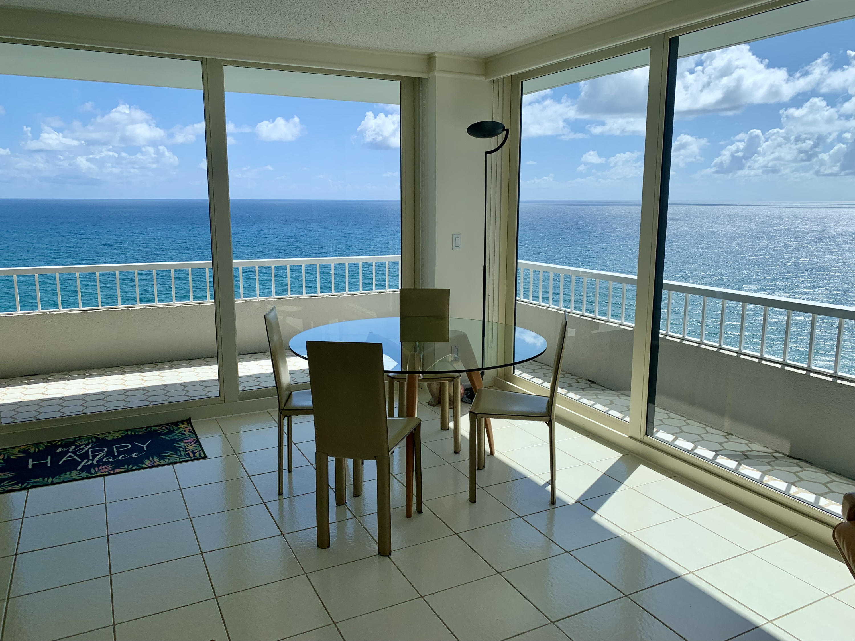 5540 North Ocean Drive, Unit PHA Riviera Beach, FL 33404 - Photo 4 of 42 a reading room with furniture and a floor to ceiling window