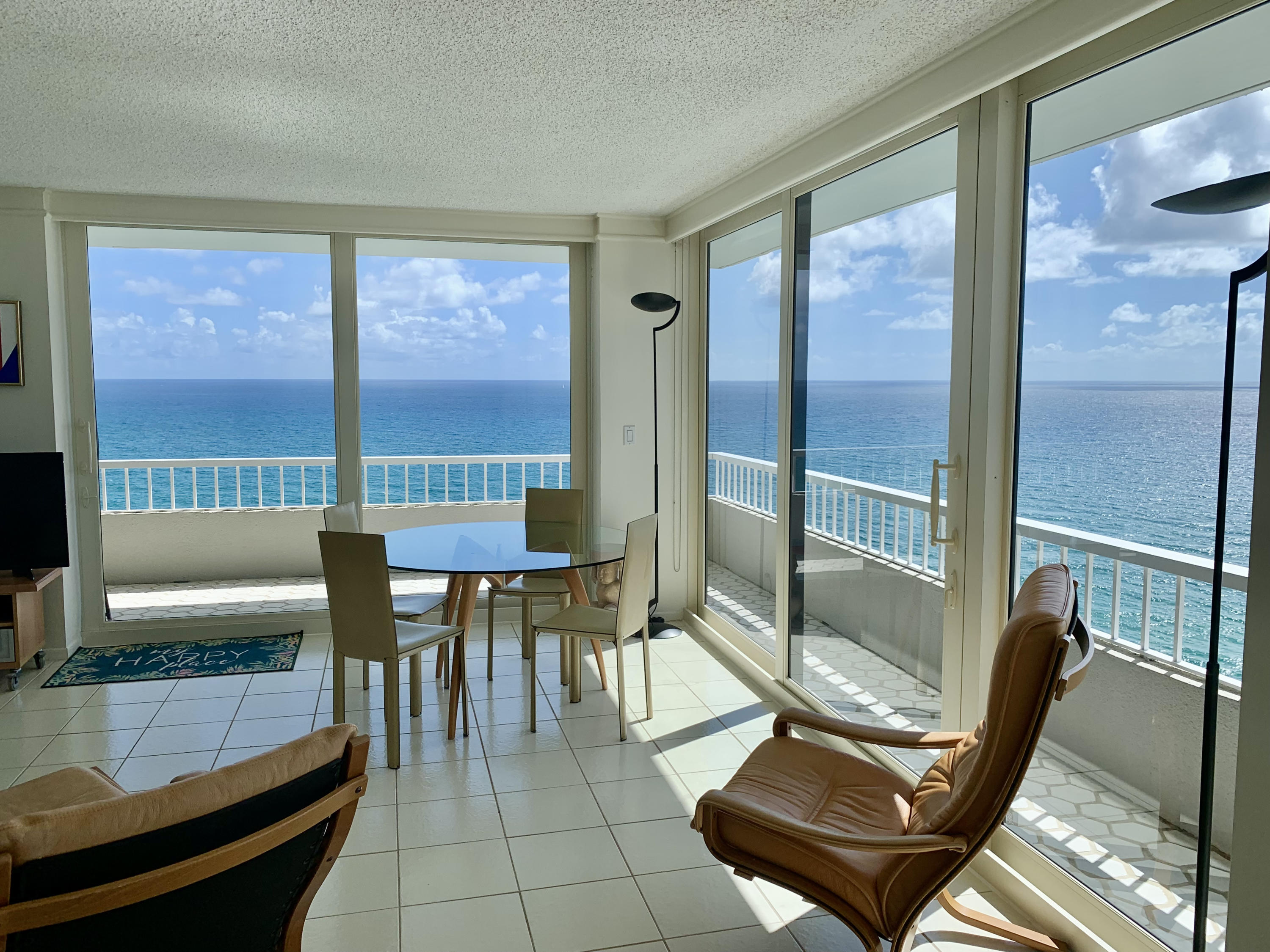 5540 North Ocean Drive, Unit PHA Riviera Beach, FL 33404 - Photo 6 of 42 a living room with furniture and a floor to ceiling window