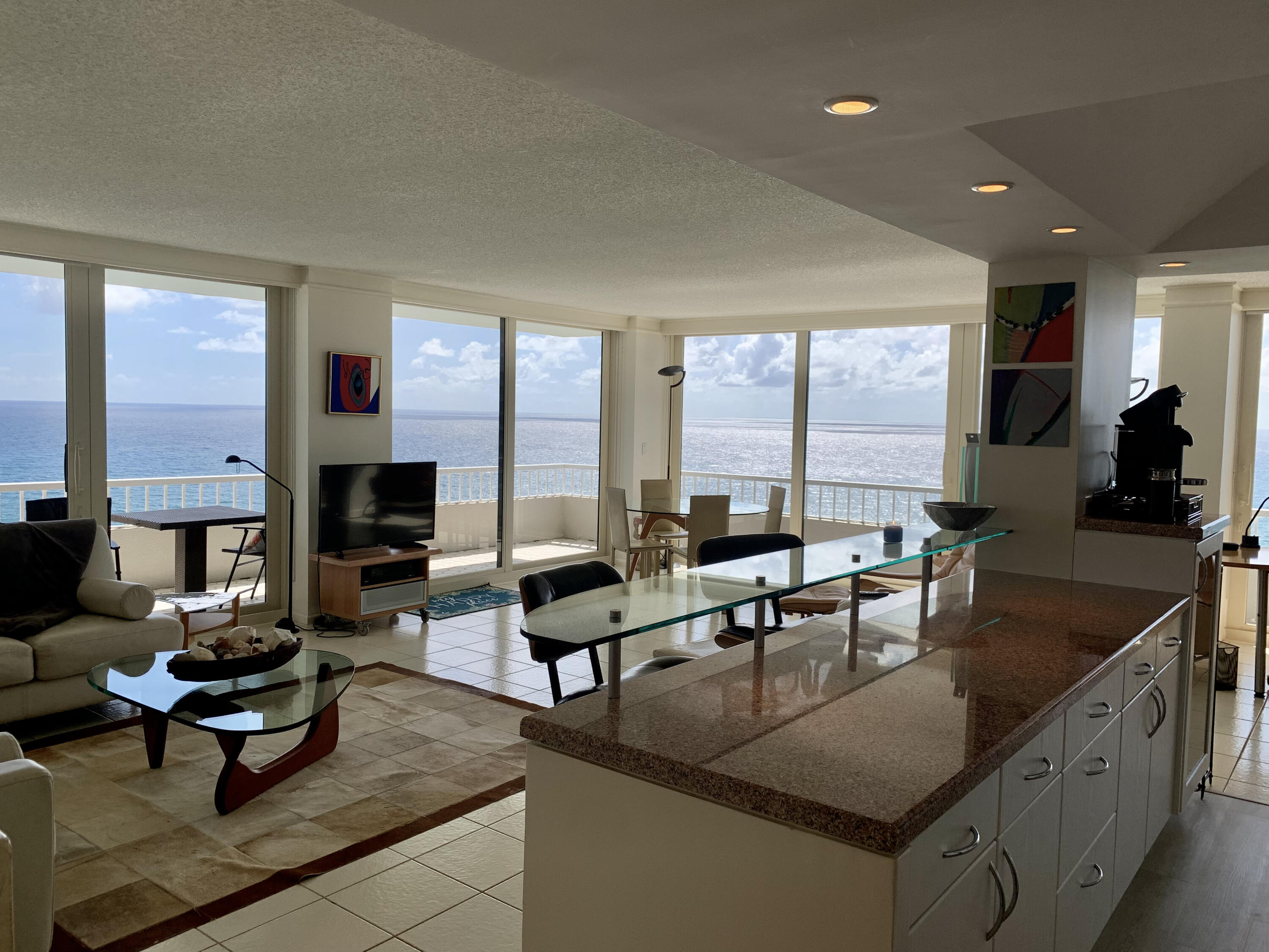 5540 North Ocean Drive, Unit PHA Riviera Beach, FL 33404 - Photo 10 of 42 a living room with furniture kitchen view and large windows