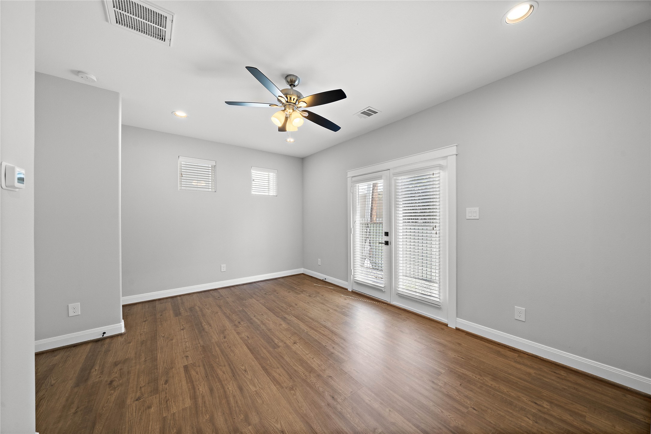 603 Link Road, Unit C Houston, TX 77009 - Photo 8 of 40 Spacious first floor bedroom with access to the outdoor space.