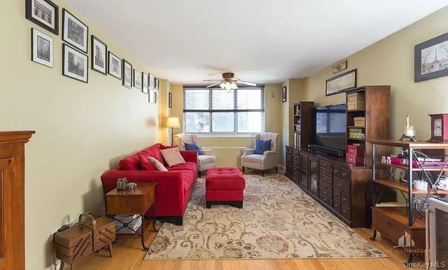 a living room with furniture and a window