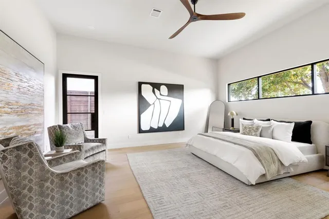 a bedroom with a bed and couch