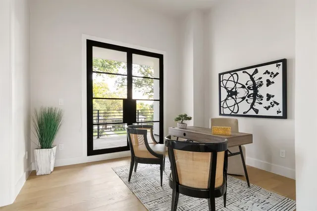a view of a dining room with furniture and window