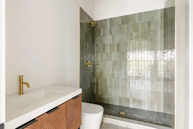 a bathroom with a sink and toilet