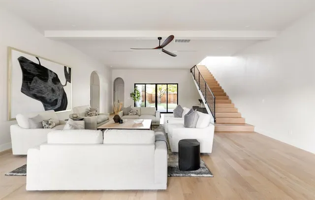 a view of living room with furniture and wooden floor