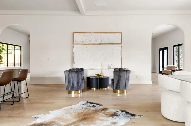 a dining room with furniture and window