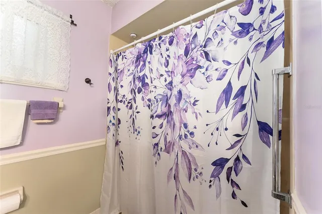 a bathroom with a shower curtain