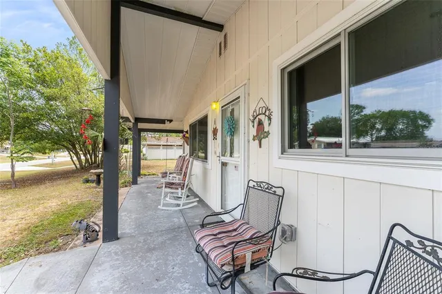 a view of two chairs in the balcony