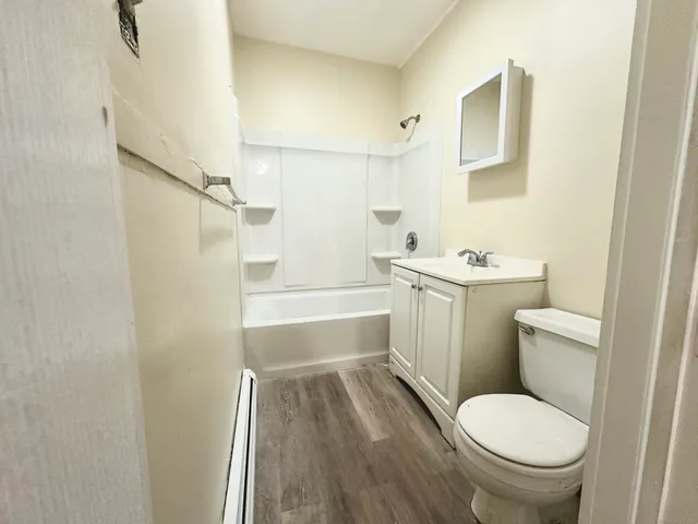a bathroom with a toilet a sink and a bathtub