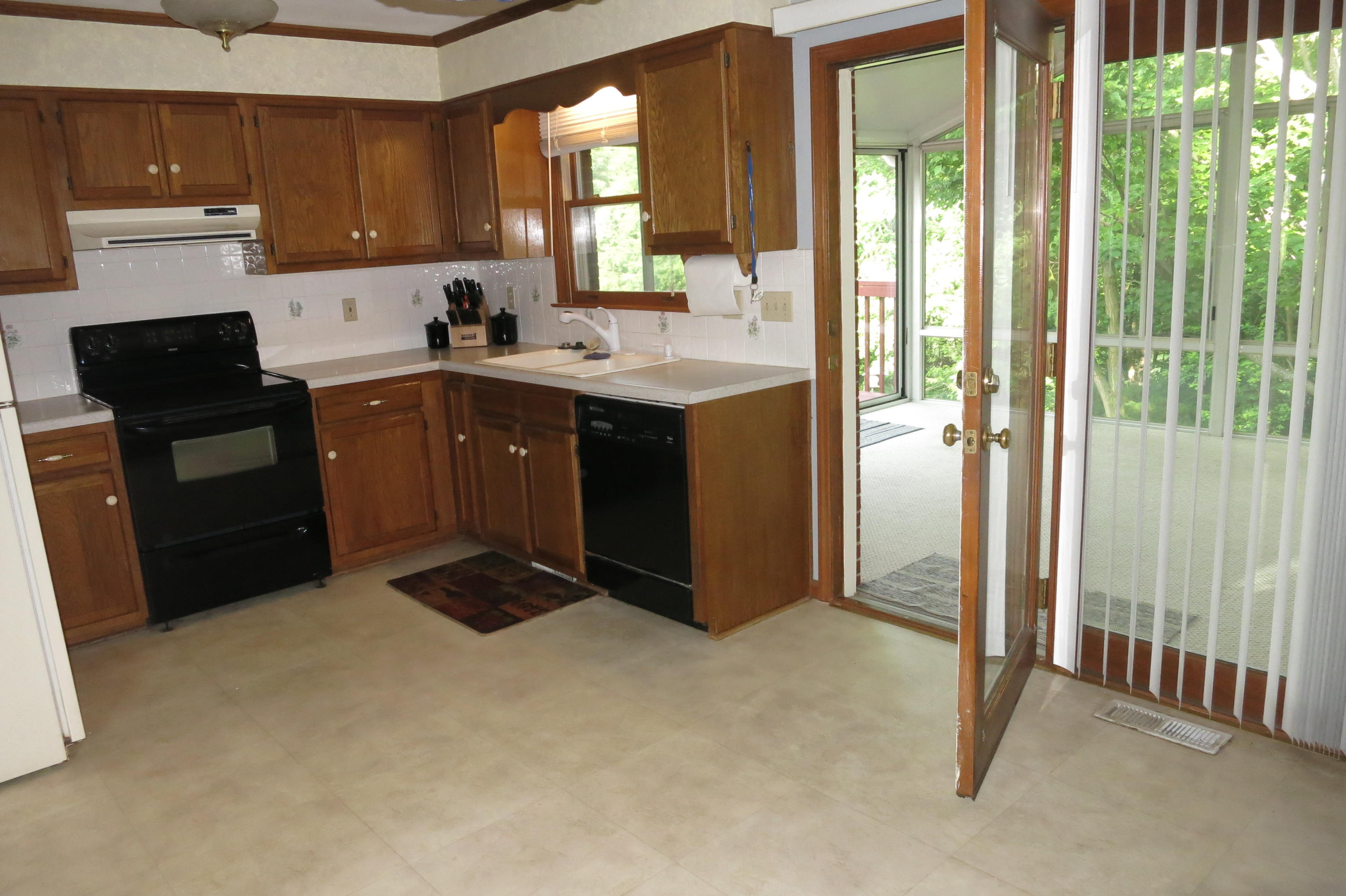 160 Stayman Road Roanoke, VA 24019 - Photo 16 of 35 Kitchen to Sunroom