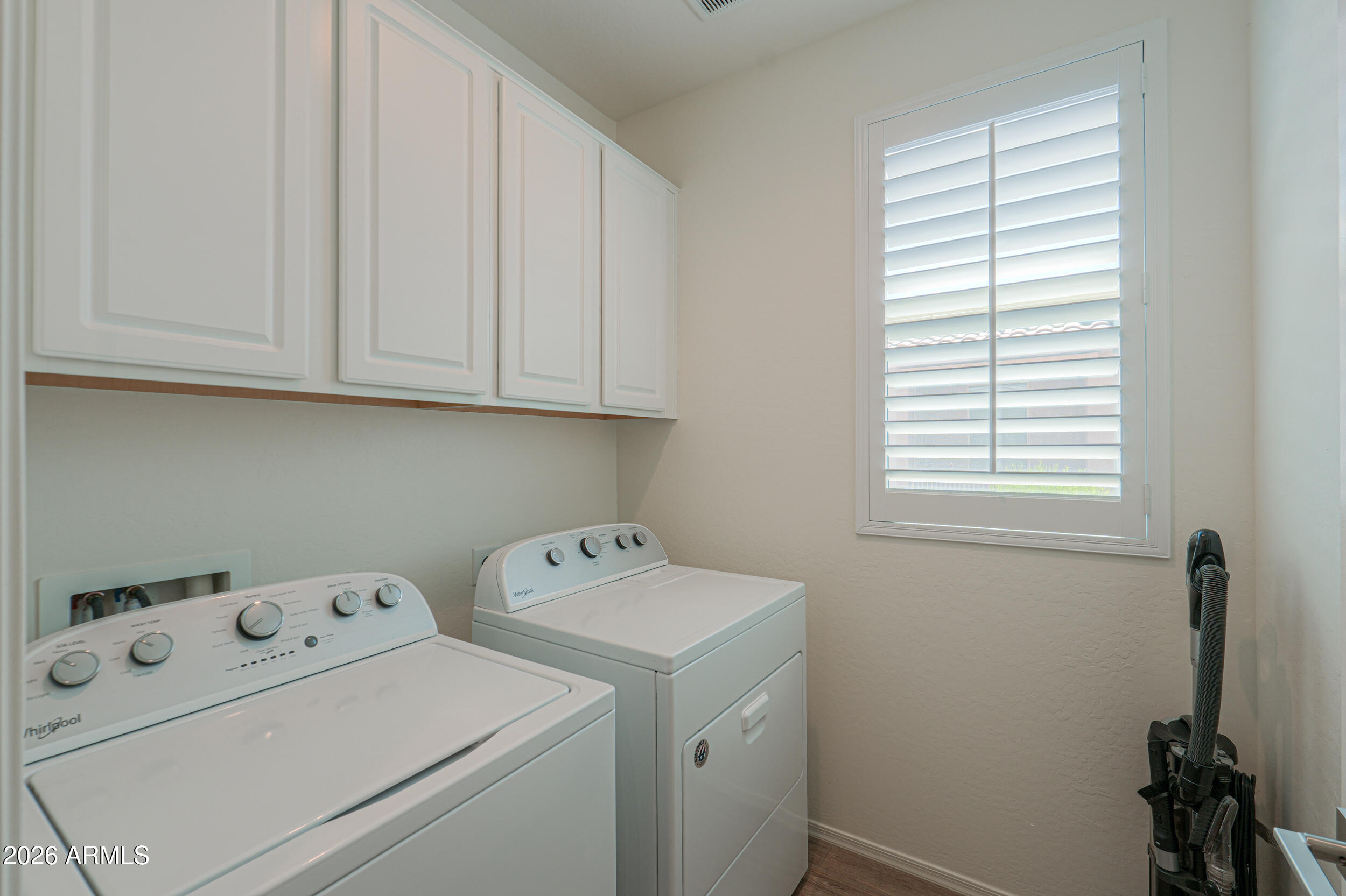 42085 West Cribbage Road Maricopa, AZ 85138 - Photo 20 of 35 a view of storage and utility room with washer and dryer