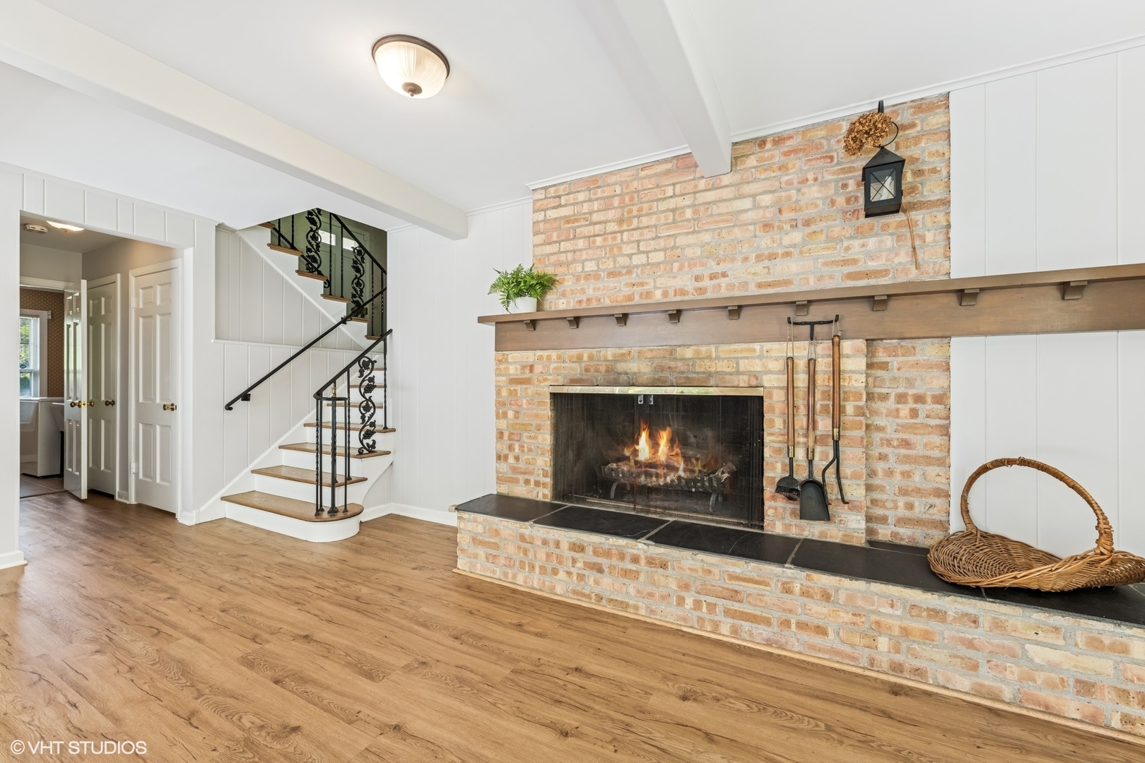 143 Firth Road Inverness, IL 60067 - Photo 12 of 31 a living room with wooden floor and a fireplace