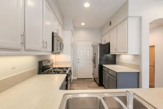 a kitchen that has a cabinets and a stove