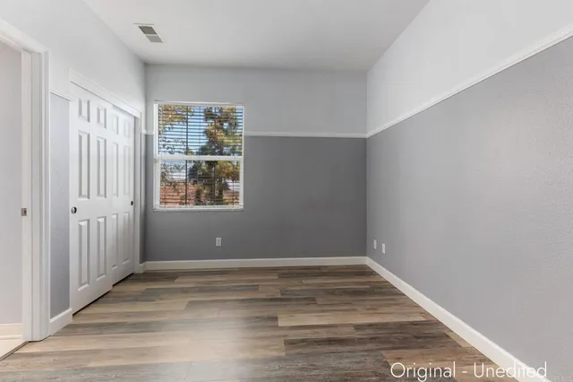 a bedroom with a bed and a couch