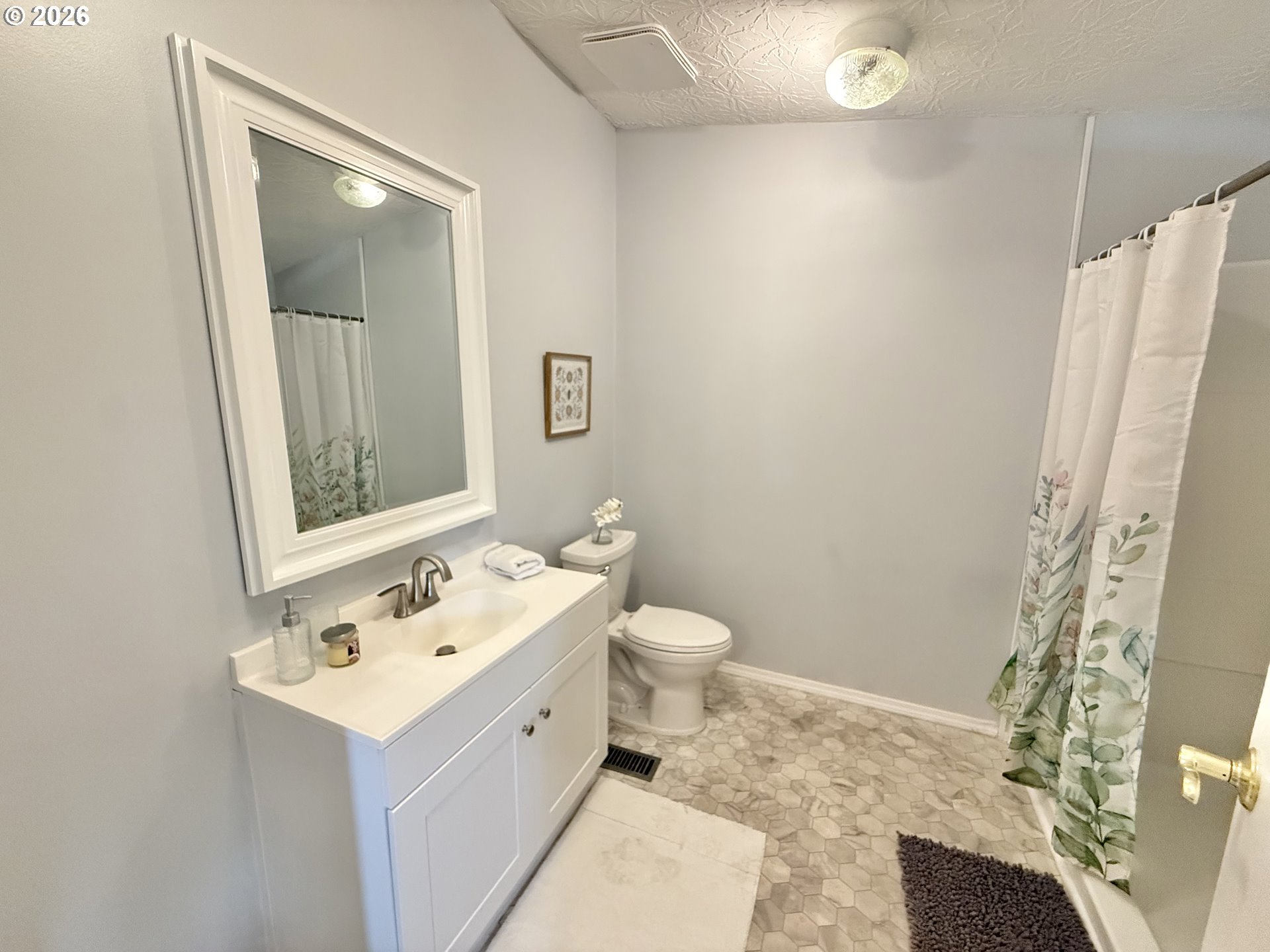 1282 3rd Street, Unit 37 Lafayette, OR 97127 - Photo 11 of 28 a bathroom with a sink toilet and mirror