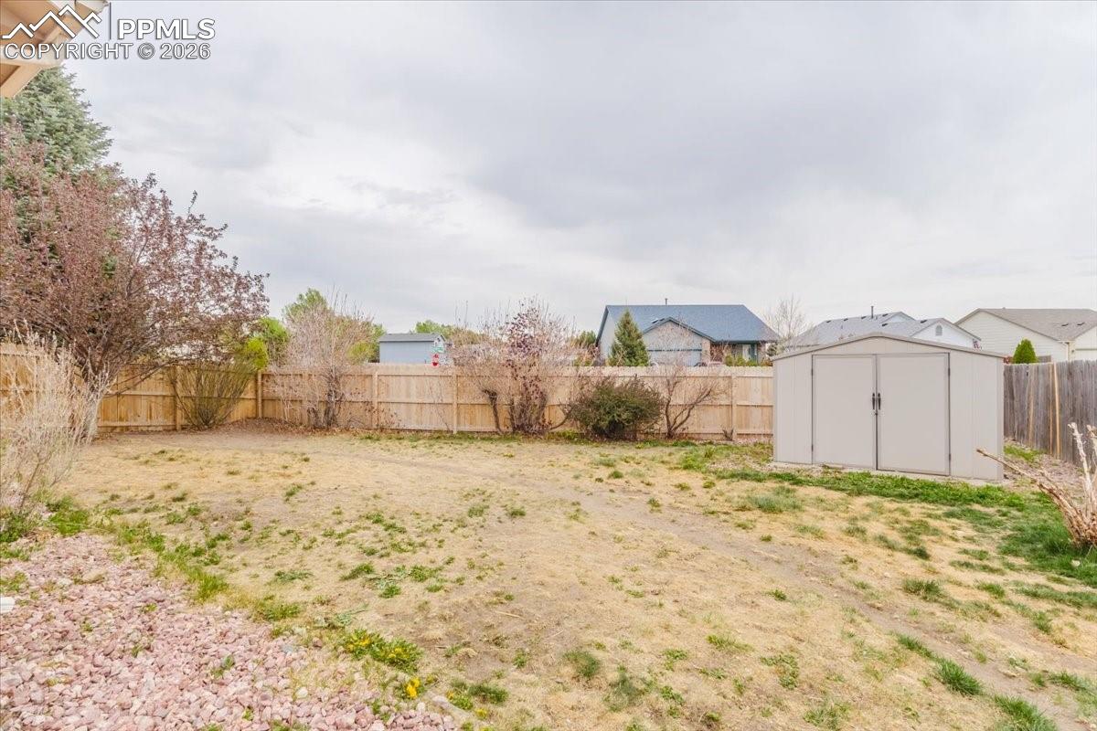 4780 Brant Road Colorado Springs, CO 80911 - Photo 43 of 49 Fenced backyard featuring a shed