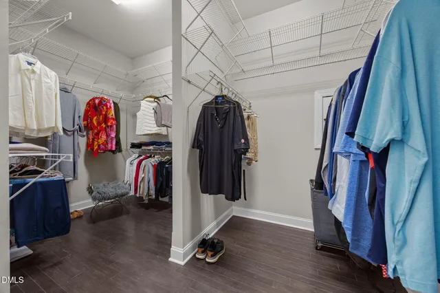 a view of a bathroom with a shower and a mirror