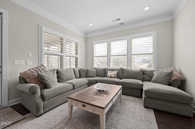 a living room with furniture and a rug