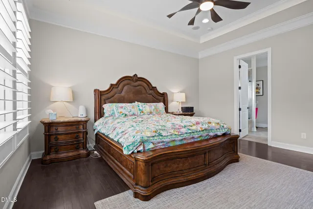a kitchen with kitchen island a sink appliances cabinets and a potted plant
