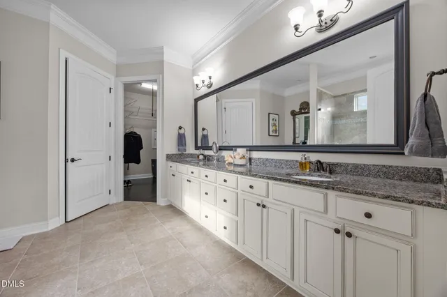 a bed room with a bed and a television