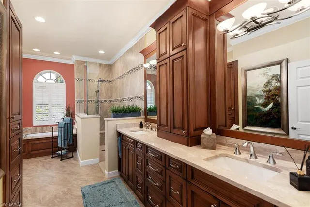 a spacious bathroom with a double vanity sink a mirror and a shower