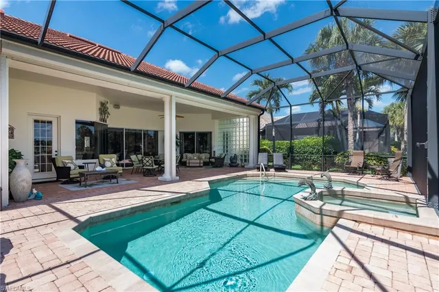 a view of a patio with a table and chairs