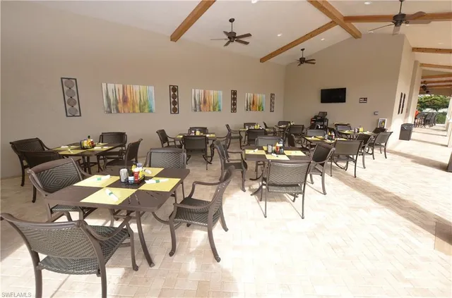 a dining room with lots of tables and chairs