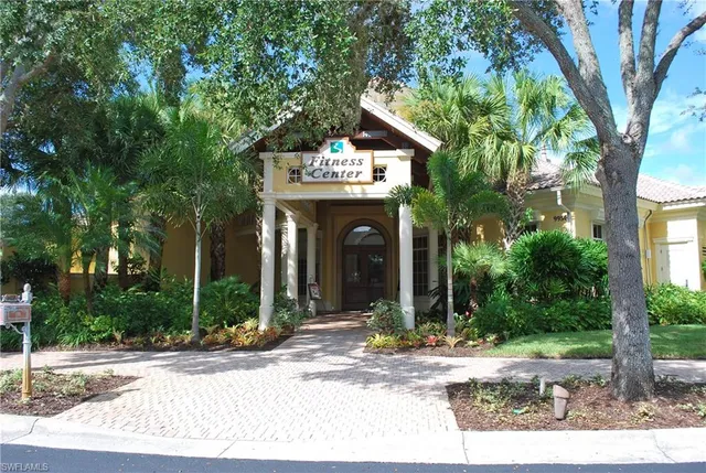 front view of a house with a tree