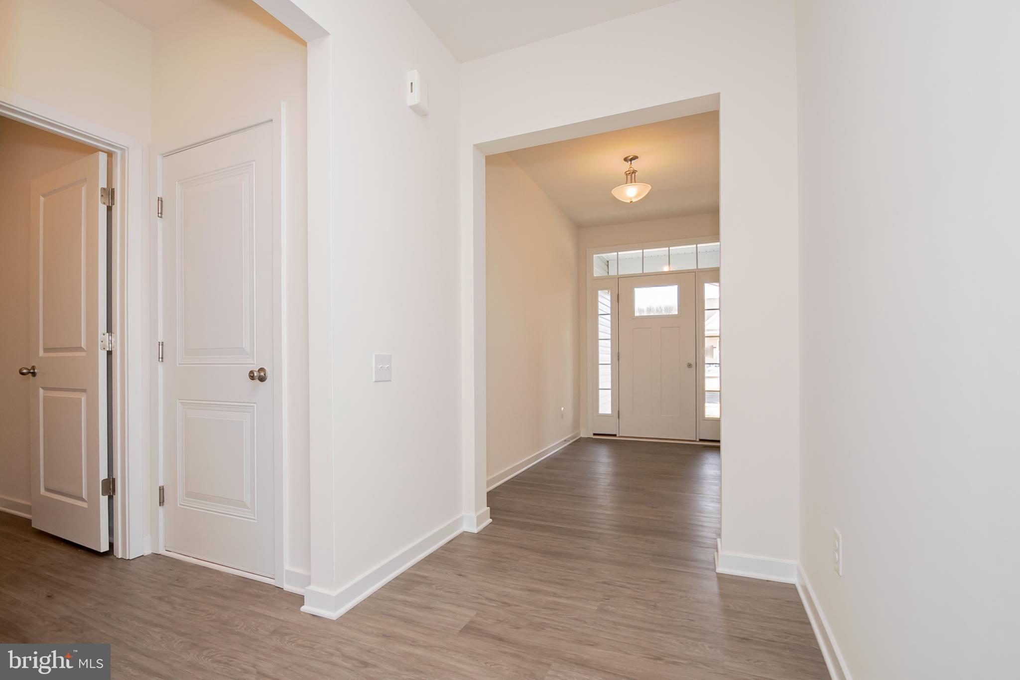 1019 Robinson Road Townsend, DE 19734 - Photo 2 of 13 a view of a hallway with wooden floor