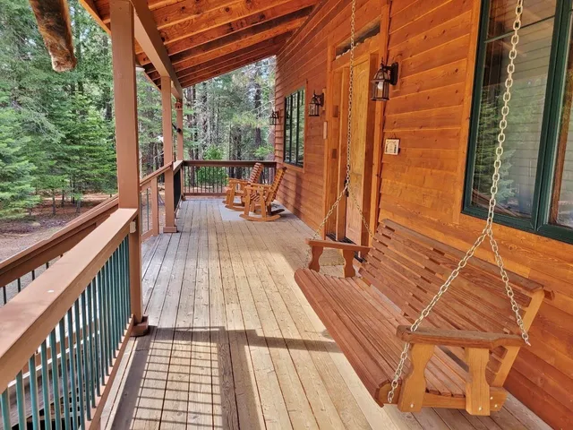 a view of balcony with wooden floor and outdoor seating